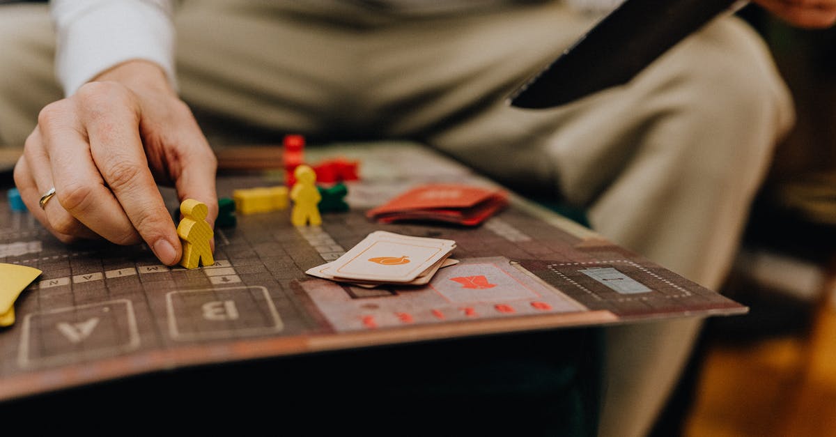 Game stats dont add up - Close-up of Man Playing Board Game Game stats dont add up - Close-up of Man Playing Board Game