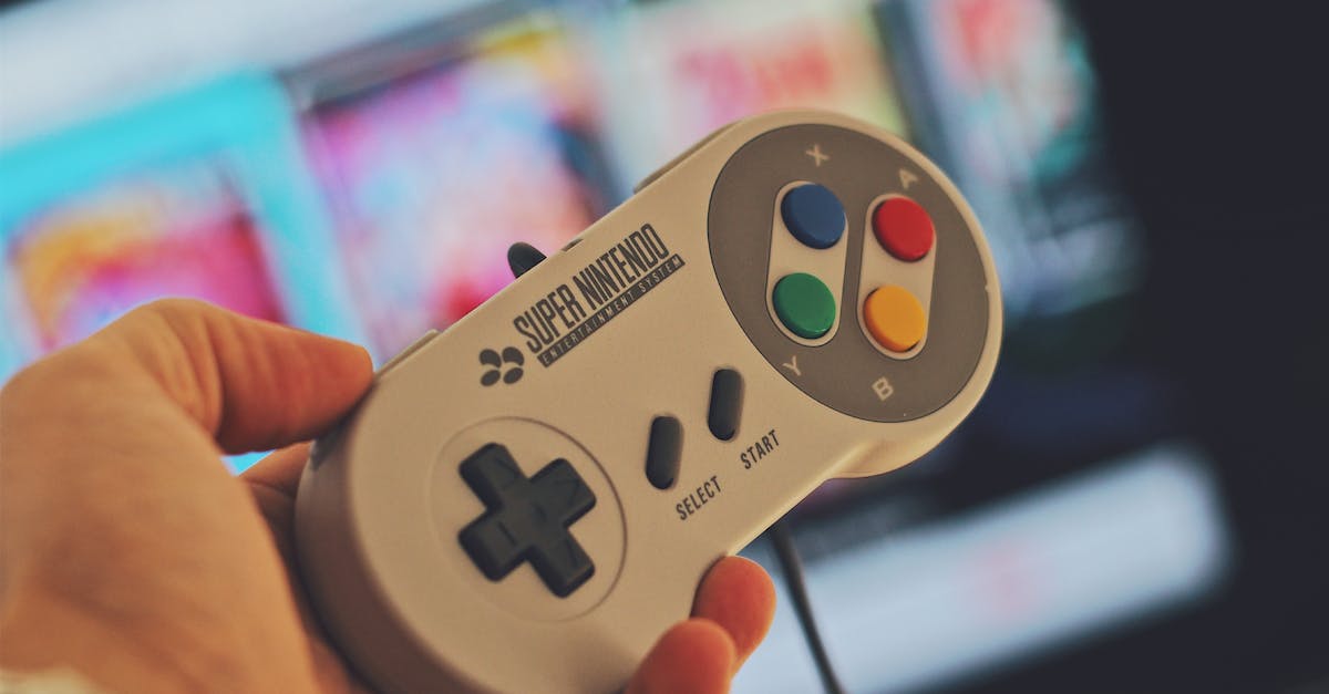 Gamepad in multiplayer games - Person Holding White Snes Controller