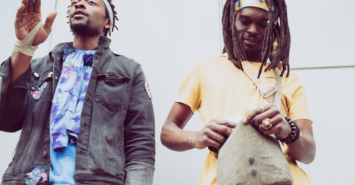 Garry's Mod Server - Friend can't see addon contents in spawn list - From below of African American hipster male with raised arm near partner with accessories and fabric bag standing near wall Garry's Mod Server - Friend can't see addon contents in spawn list - From below of African American hipster male with raised arm near partner with accessories and fabric bag standing near wall