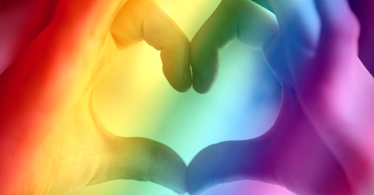 Gender labels on trainer badges in Pokémon Go - Person's Hand Forming Heart