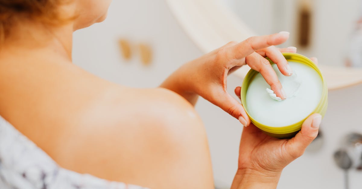 Getting More Health - A Woman Applying Cream Getting More Health - A Woman Applying Cream