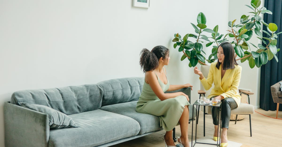 Getting More Health - 2 Women Sitting on Gray Couch Getting More Health - 2 Women Sitting on Gray Couch