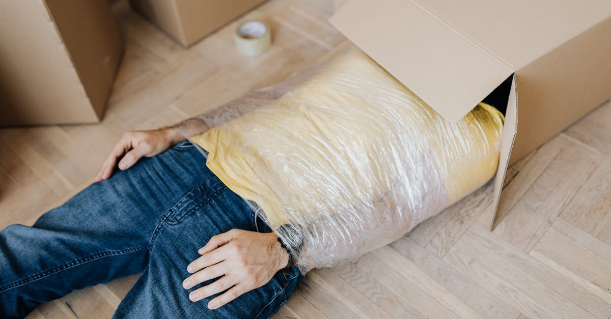 Getting real tired of the other players being cheeky - Man tied up using tape with head in carton box Getting real tired of the other players being cheeky - Man tied up using tape with head in carton box