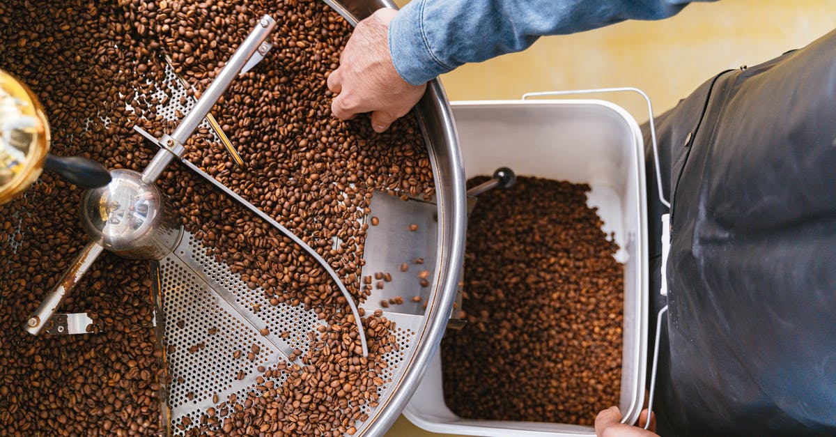 Getting Spells IDs from WoW - A Person Holding a Bucket while Getting Coffee Beans From the Machine Getting Spells IDs from WoW - A Person Holding a Bucket while Getting Coffee Beans From the Machine