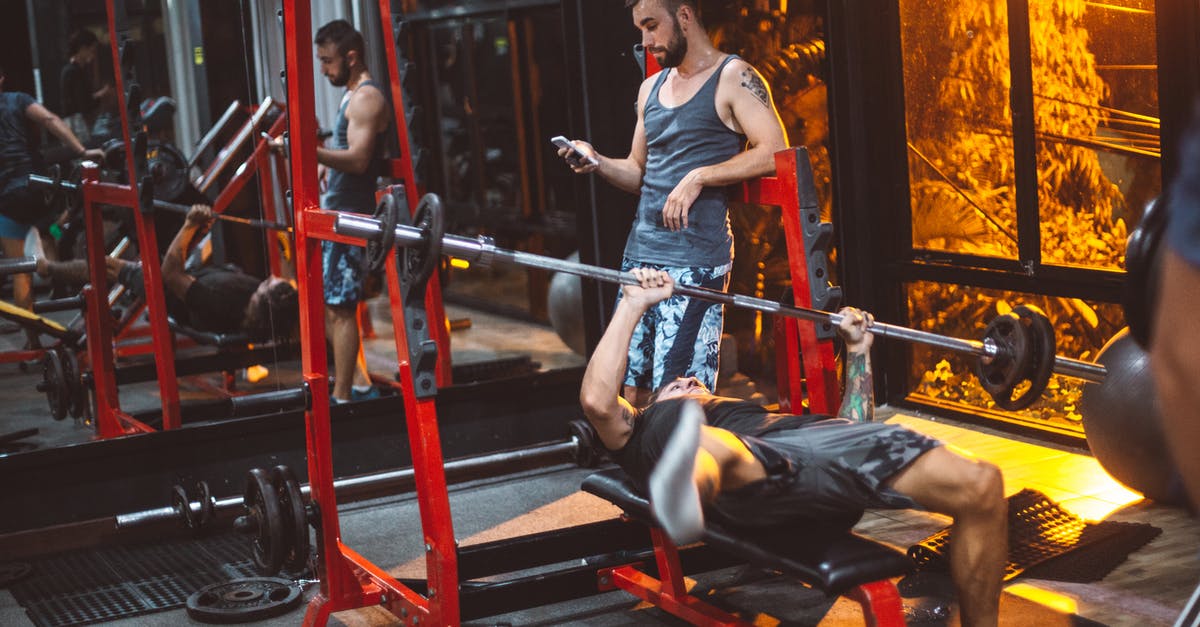 Getting to use Power Within more than once? - Sporty fitness trainer and man lifting barbell Getting to use Power Within more than once? - Sporty fitness trainer and man lifting barbell