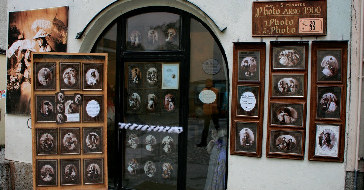 Given a Hearthstone card collection how to determine the optimal card pack to purchase? - Exhibited samples of vintage photos in frames for sale on wall of small local shop