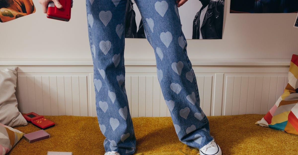 Giving player extra hearts - Person Wearing a Denim Pants Printed with Hearts