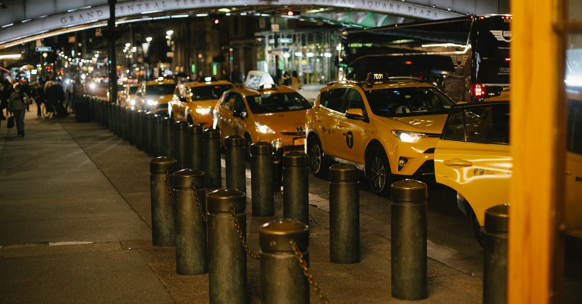 Grand Theft Auto 5 autosave - Row of modern shiny yellow taxis with glowing headlights parked at roadside near Grand Central Terminal in New York at night Grand Theft Auto 5 autosave - Row of modern shiny yellow taxis with glowing headlights parked at roadside near Grand Central Terminal in New York at night
