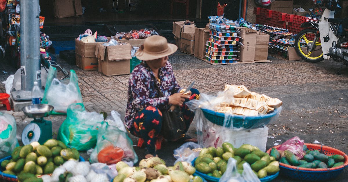 Gree Enclave Reputation Vendor available? - Street Vendor Cutting up Fruits