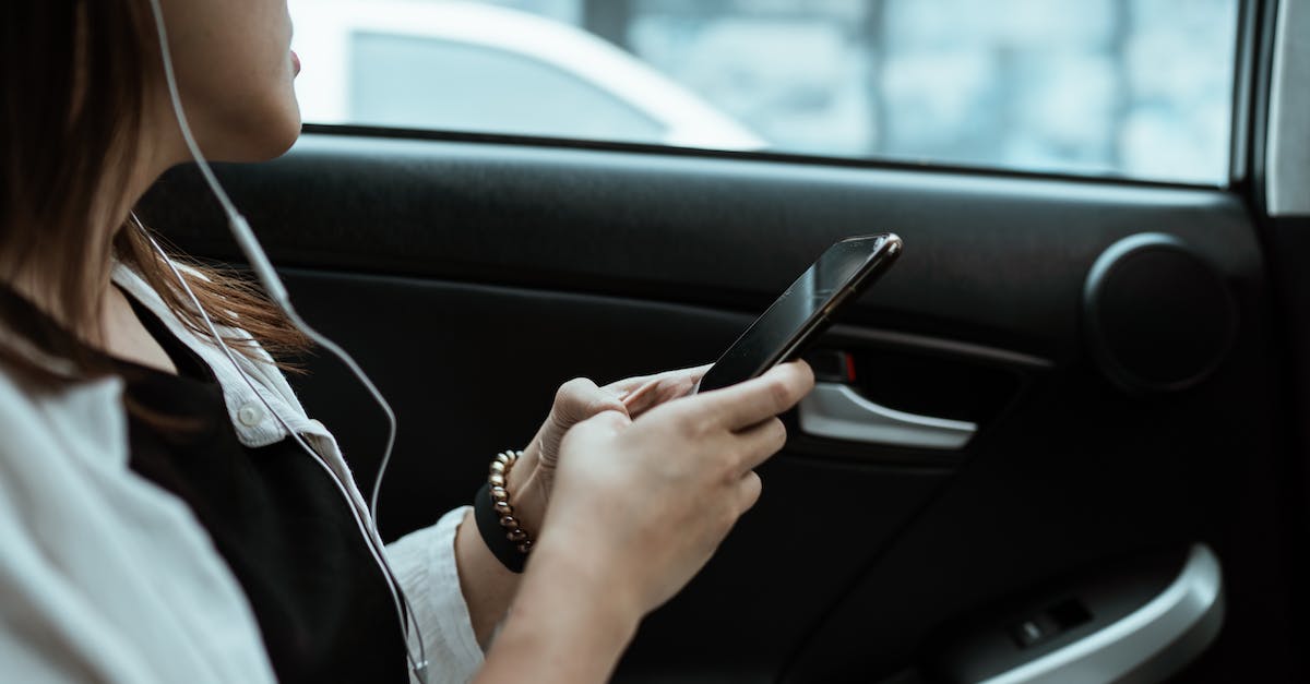 GTA 5 online missing cars - Crop unrecognizable woman listening to music on smartphone in car