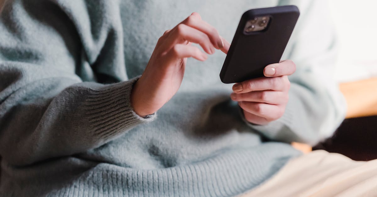 GTA 5 Online not detected my Wi-Fi to login in online GTA - Crop faceless female in casual clothes using smartphone and touching screen while chilling at home