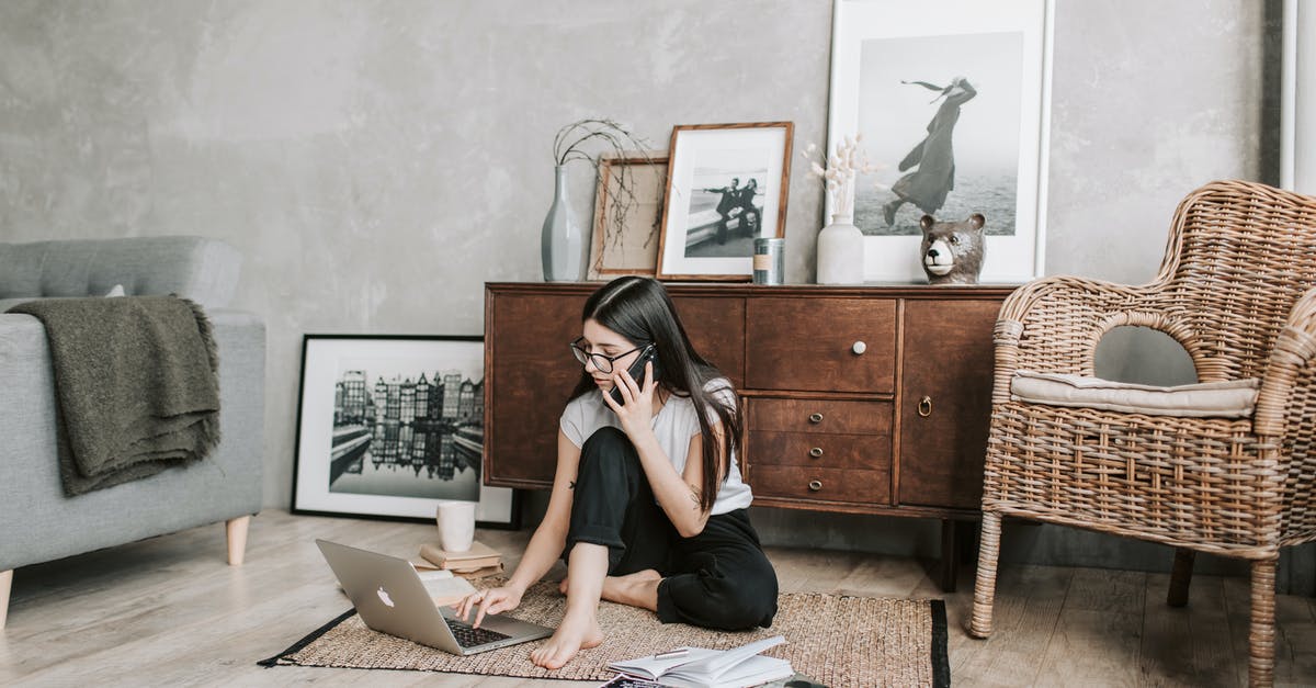 GTA not using full GPU capacity - Focused young woman with laptop and smartphone in modern apartment GTA not using full GPU capacity - Focused young woman with laptop and smartphone in modern apartment