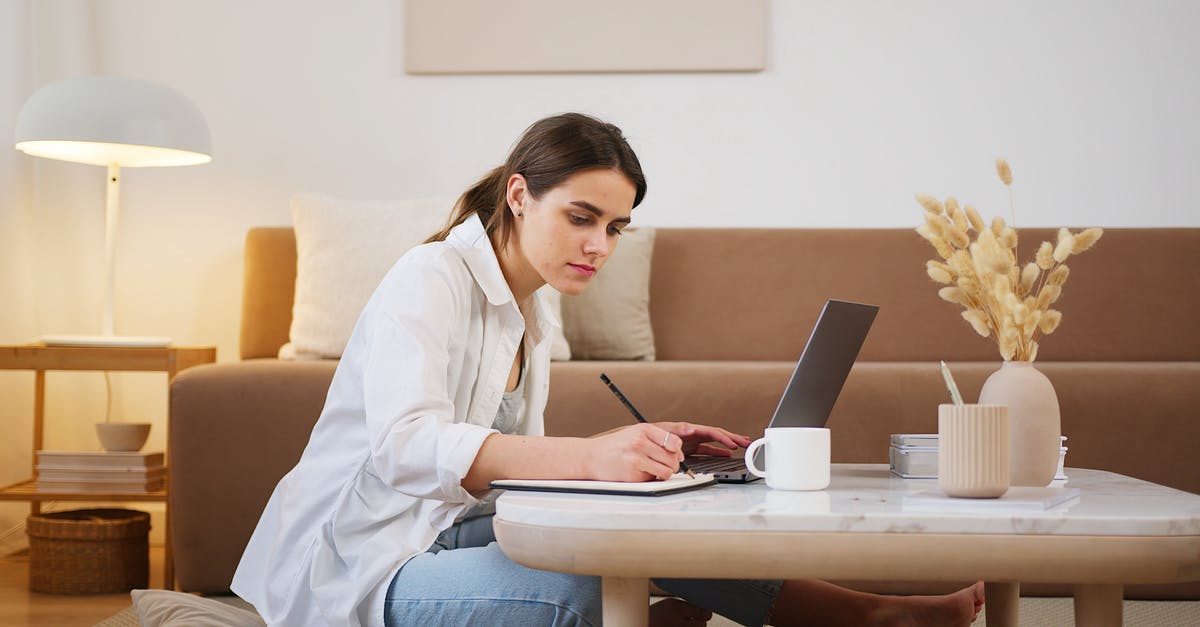 GTA not using full GPU capacity - Side view full length young focused female in casual clothes browsing modern laptop and writing down notes while sitting on floor in cozy modern apartment GTA not using full GPU capacity - Side view full length young focused female in casual clothes browsing modern laptop and writing down notes while sitting on floor in cozy modern apartment