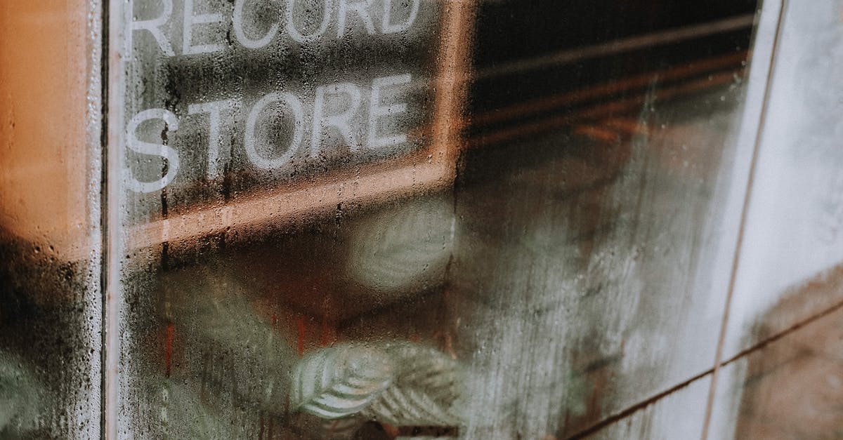 Gunpoint: How To Get The Clean Record Achievement? - High angle of transparent glass wall with wet surface covered with water drops of record store Gunpoint: How To Get The Clean Record Achievement? - High angle of transparent glass wall with wet surface covered with water drops of record store