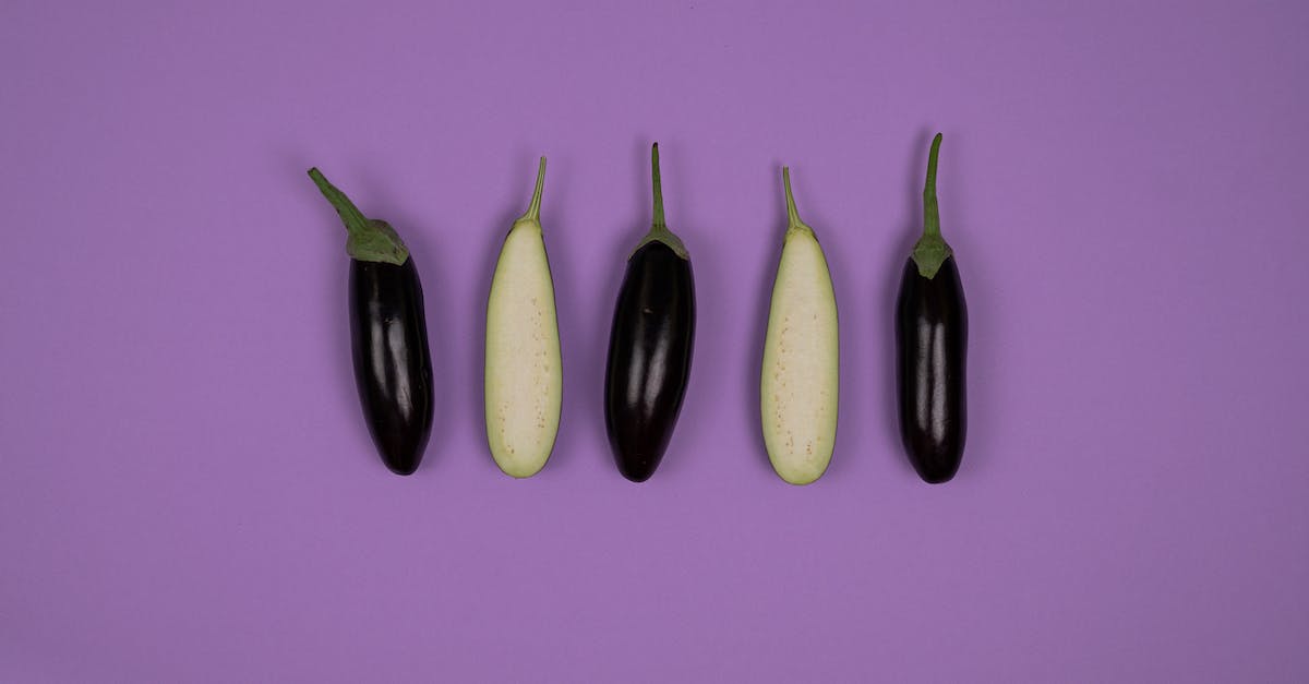 Half Life 2 in Linux on Oculus Rift - Top view of ripe isolated whole and cut eggplants placed on purple background