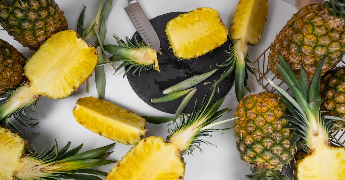 Half my house disappeared for no reason at all why? [duplicate] - Ripe pineapples on table with knife in kitchen