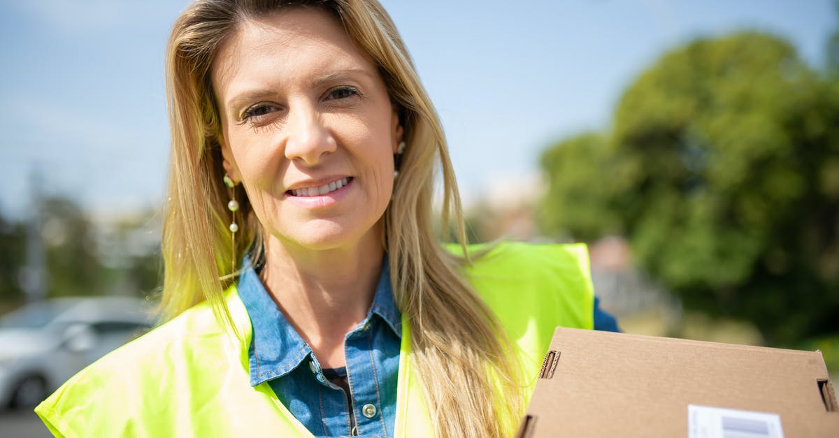 Halo Franchise In A Chronological Order [closed] - Close-Up Shot of a Deliverywoman Holding a Box
