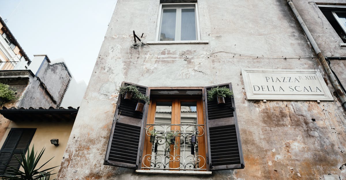 Hamachi on Windows 10 - Brown Wooden Window on White Concrete Building Hamachi on Windows 10 - Brown Wooden Window on White Concrete Building