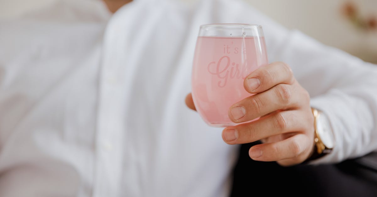 Harrison Jones and its usage - A Person Holding a Pink Colored Beverage Harrison Jones and its usage - A Person Holding a Pink Colored Beverage