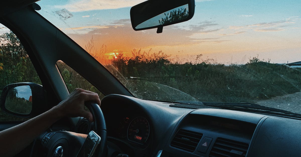 Have Elite Dangerous use Stereo instead of Hands-Free? - Crop unrecognizable person browsing mobile phone and driving car along rural gravel road in sunset time Have Elite Dangerous use Stereo instead of Hands-Free? - Crop unrecognizable person browsing mobile phone and driving car along rural gravel road in sunset time