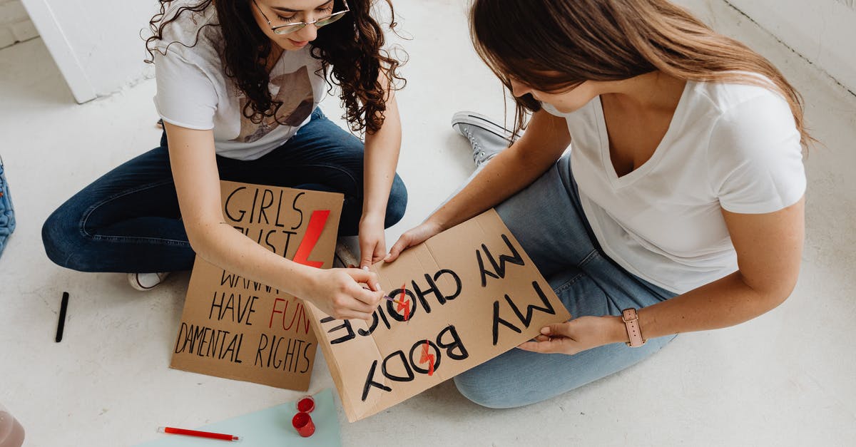 Have I just become immortal? - Woman in White Shirt Holding Brown Wooden Board Have I just become immortal? - Woman in White Shirt Holding Brown Wooden Board