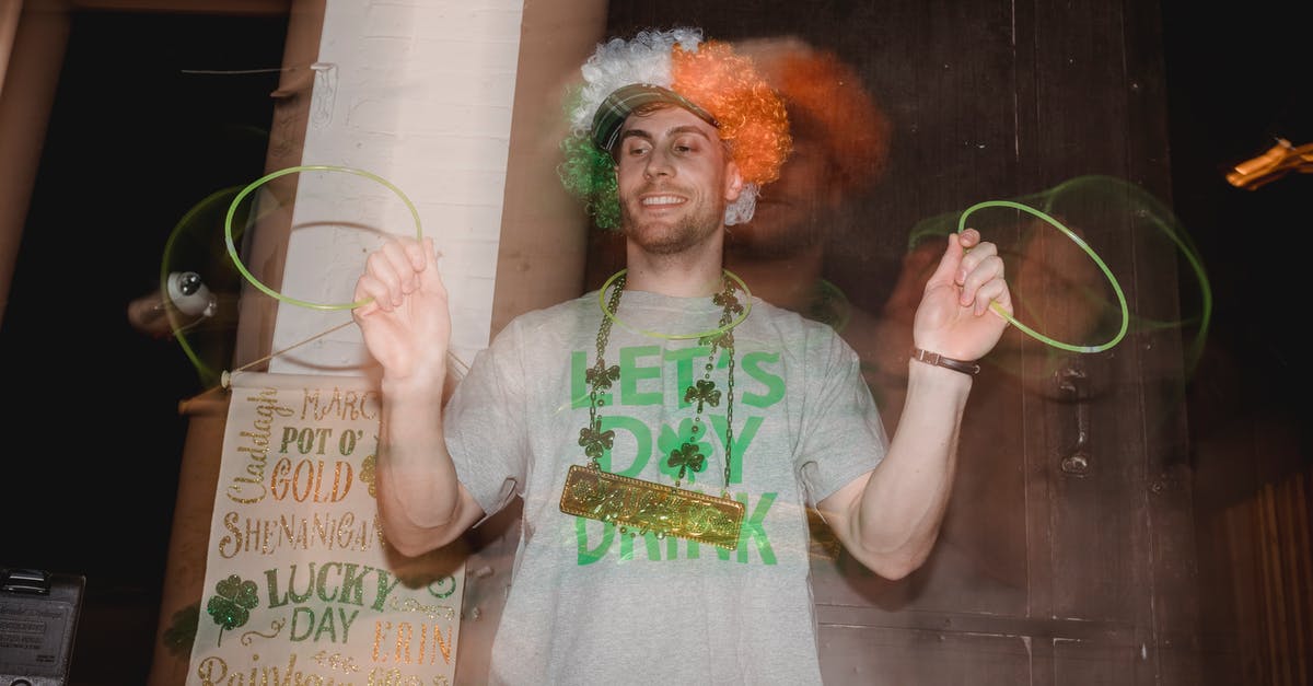 Having problems with the Festival Dance mini-game - Positive young man dancing with neon glow stick necklace Having problems with the Festival Dance mini-game - Positive young man dancing with neon glow stick necklace