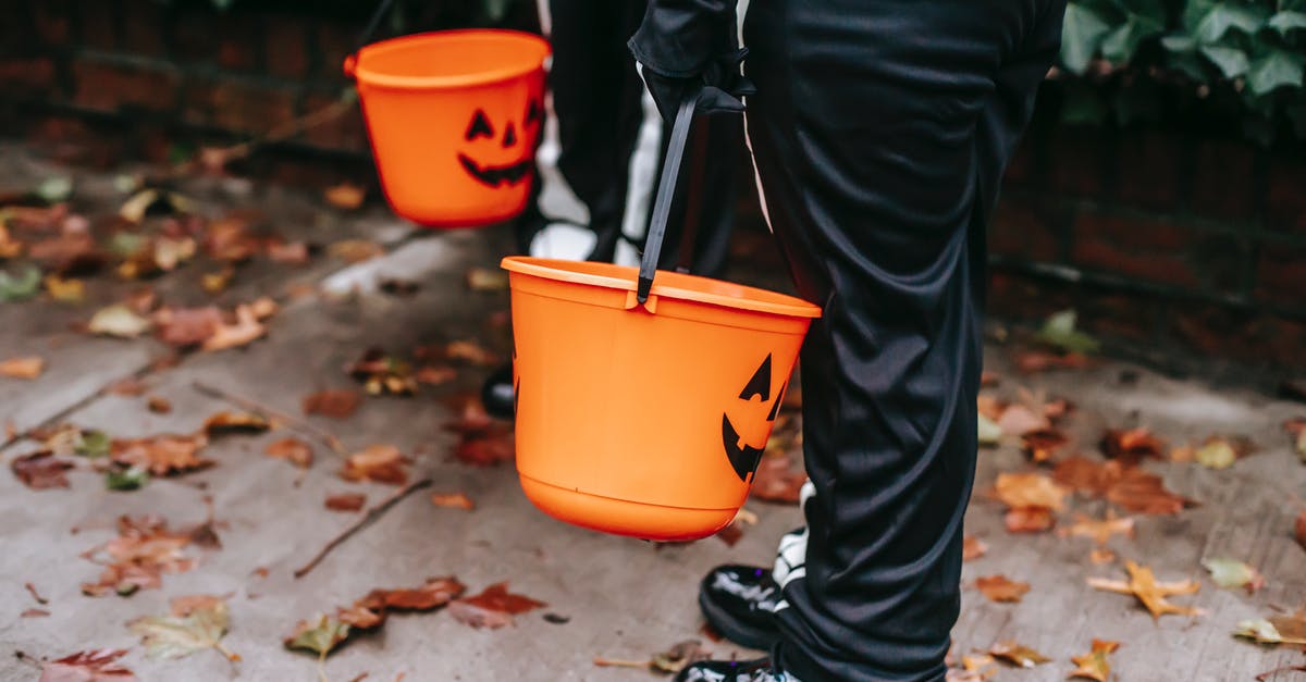 Hay day neighborhood not appearing in search list - Crop faceless kids in black costumes trick or treating with orange buckets in Halloween in daytime Hay day neighborhood not appearing in search list - Crop faceless kids in black costumes trick or treating with orange buckets in Halloween in daytime