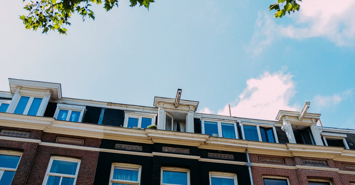 Hay day neighborhood not appearing in search list - From below of old building with white windows and brick walls against blue sky on sunny day Hay day neighborhood not appearing in search list - From below of old building with white windows and brick walls against blue sky on sunny day