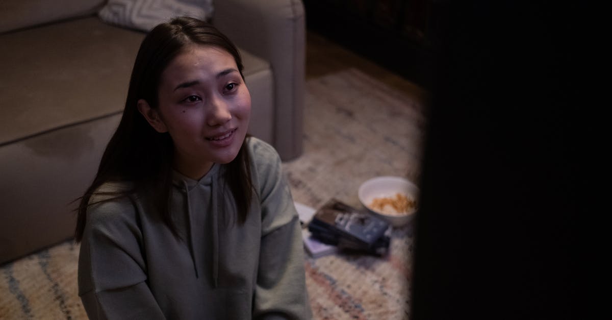 HDTV and Apple TV into Xbox One - Young girl sitting on floor and watching TV HDTV and Apple TV into Xbox One - Young girl sitting on floor and watching TV