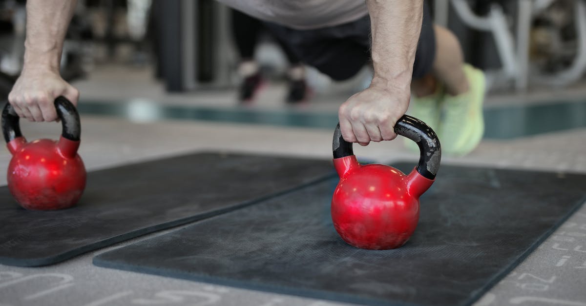 Health to Stamina ratio to warriors in skyrim? - Muscular sportsman doing plank exercise on kettlebells Health to Stamina ratio to warriors in skyrim? - Muscular sportsman doing plank exercise on kettlebells