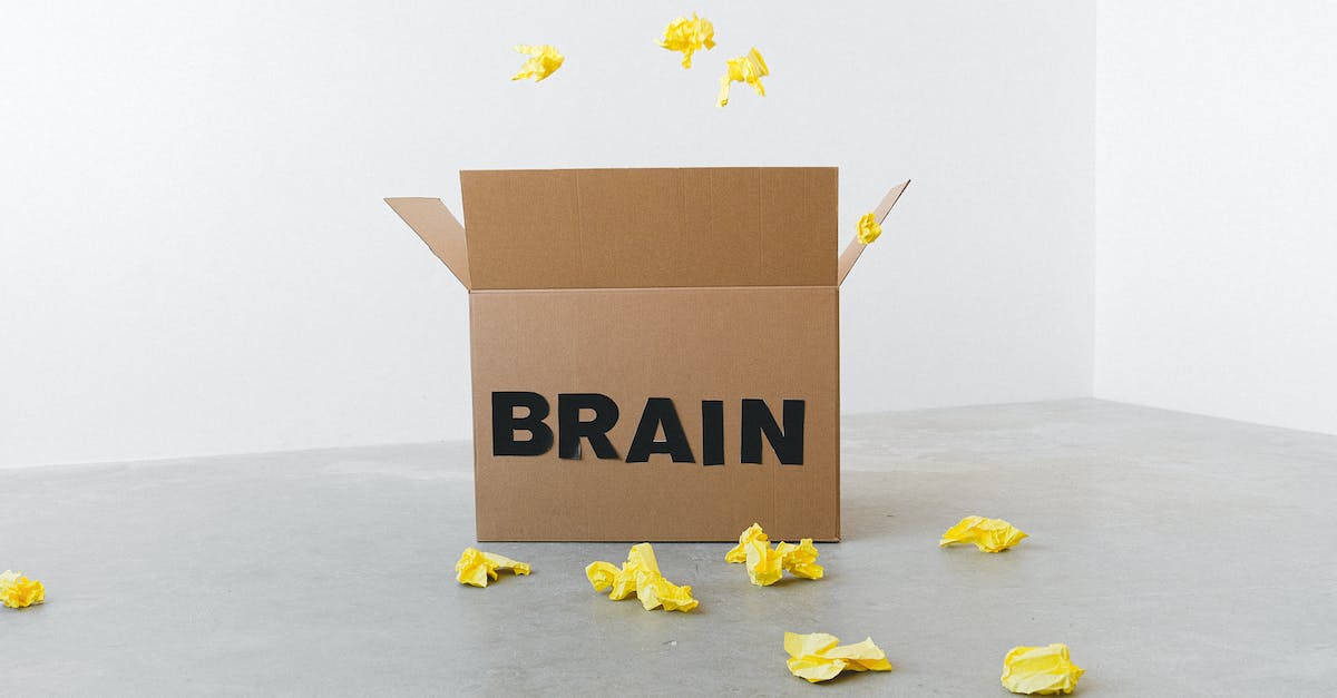 Hearthstone opening strategies: why waste mana? - Crumpled yellow paper pieces on floor near carton box with Brain title on white background