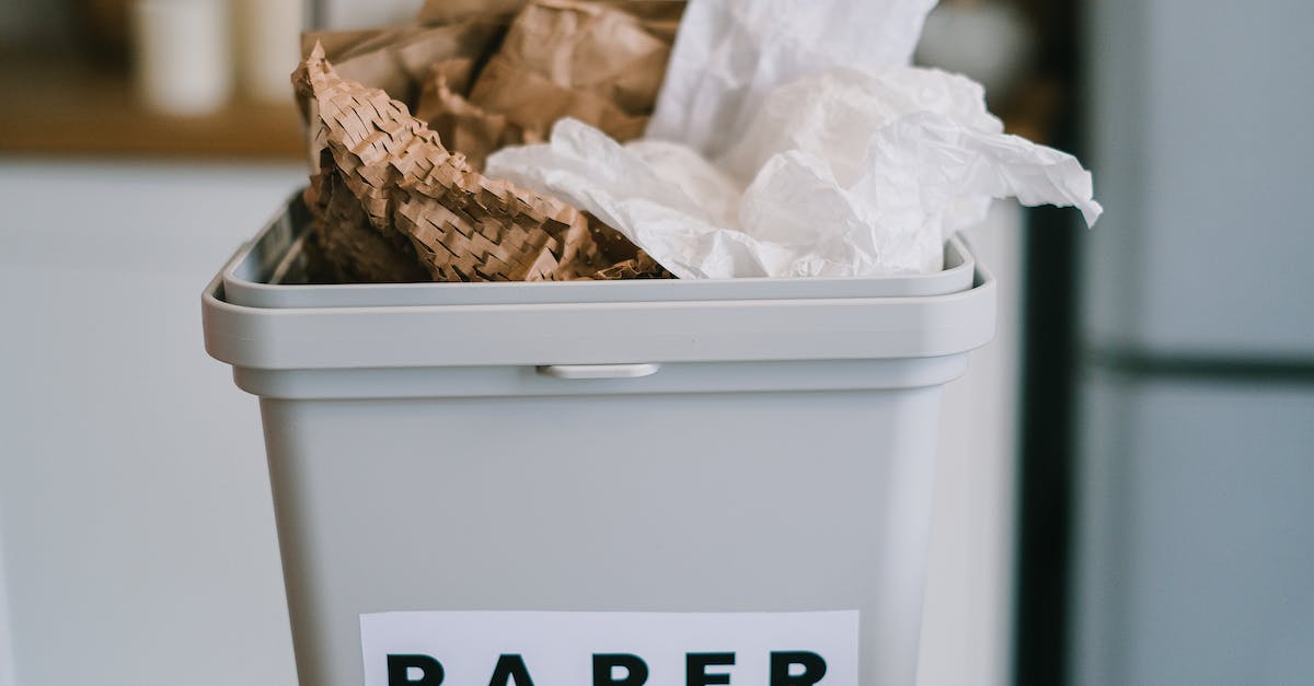 Hearthstone opening strategies: why waste mana? - Closeup of plastic container full of paper placed on blurred background of kitchen in daytime
