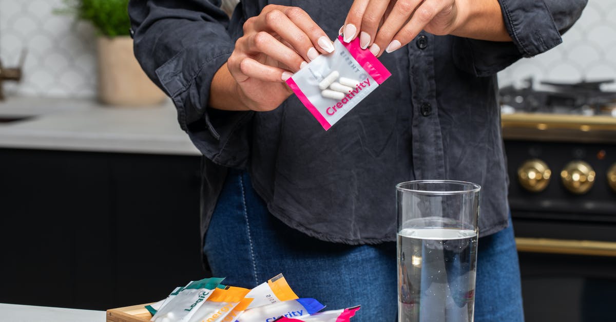 Hearthstone Pack Opening Interuption - A Person Holding a Pack of Pills with a Label Creativity