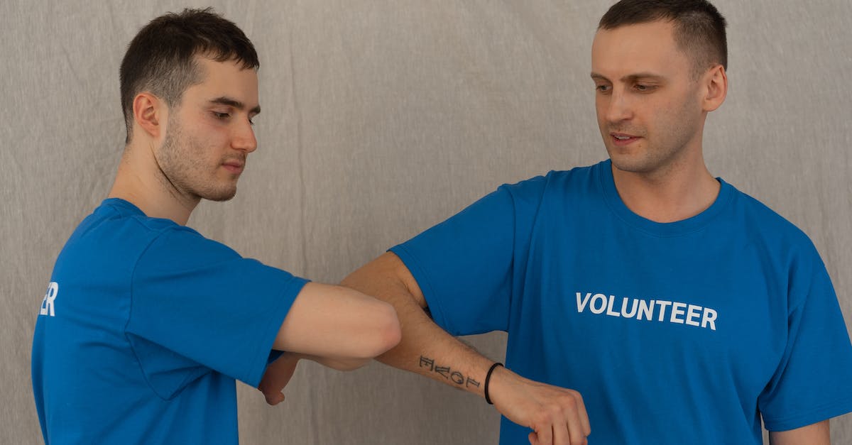 Help with Level 16's lazers - Man in Blue Crew Neck T-shirt Standing Beside White Wall