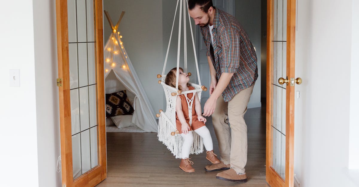 Help with Steam game files [duplicate] - Side view of young male parent in casual wear and little daughter looking at each other playing together in cozy room at home