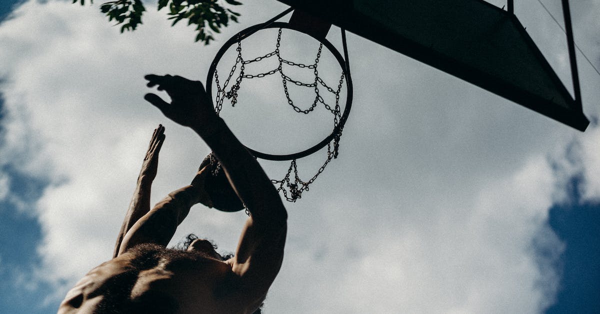 High score for both? - Low Angle Photography of Basketball Dunk