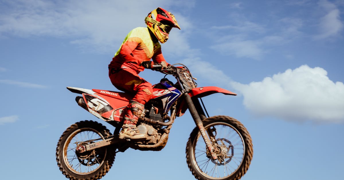 Highest Jump Boost - Man in Red and Black Motocross Suit Riding Motocross Dirt Bike Highest Jump Boost - Man in Red and Black Motocross Suit Riding Motocross Dirt Bike
