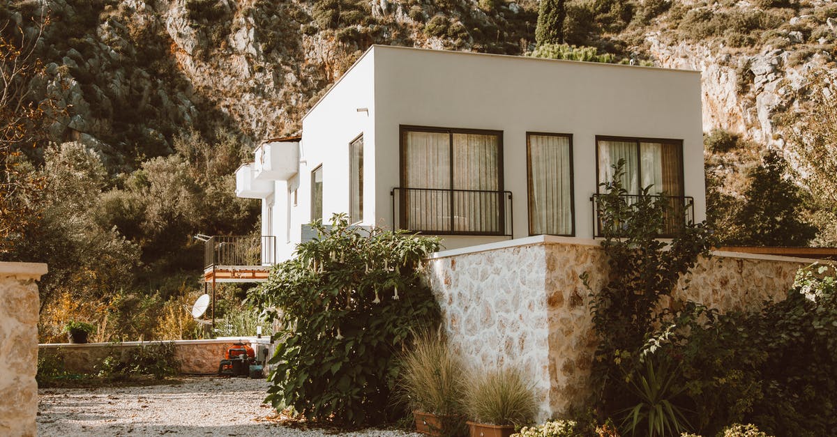 Houses keep catching fire, why? - White Concrete House Near Green Trees Houses keep catching fire, why? - White Concrete House Near Green Trees