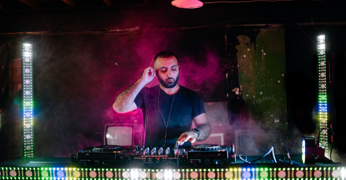 How am I playing on the installation disc? - A Disc Jockey Playing Music on His Booth