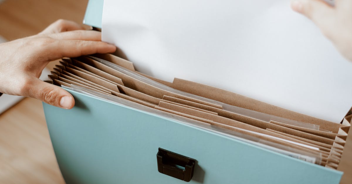 How am I supposed to put out fires? - Person taking white paper from folder How am I supposed to put out fires? - Person taking white paper from folder