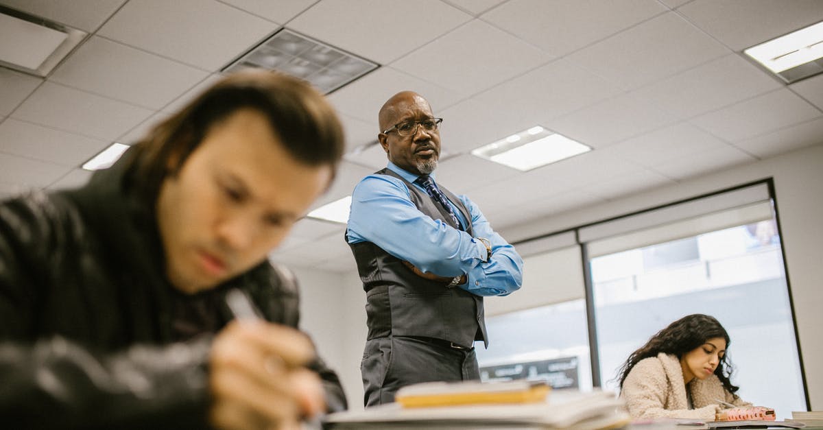 How are PCS upgrades obtained? - Teacher Proctoring His Students During an Examination How are PCS upgrades obtained? - Teacher Proctoring His Students During an Examination