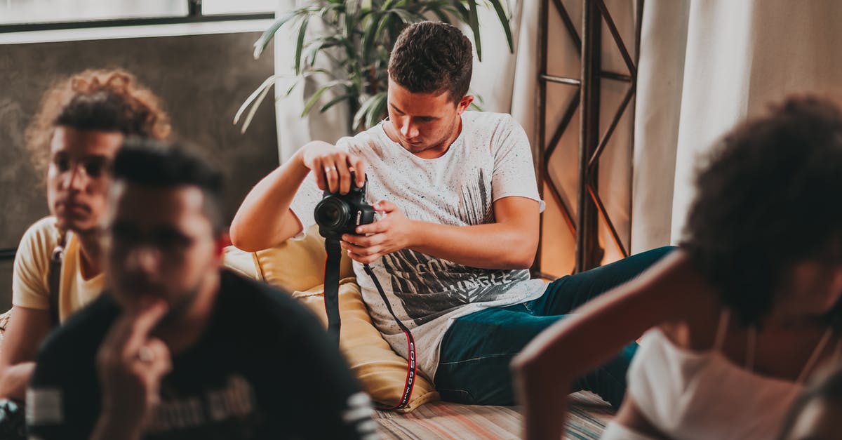 How are some channels creating Minecraft 'Timelapse' videos, pausing gameplay yet moving the camera? - Concentrated young man taking photos on professional camera during work in modern studio How are some channels creating Minecraft 'Timelapse' videos, pausing gameplay yet moving the camera? - Concentrated young man taking photos on professional camera during work in modern studio