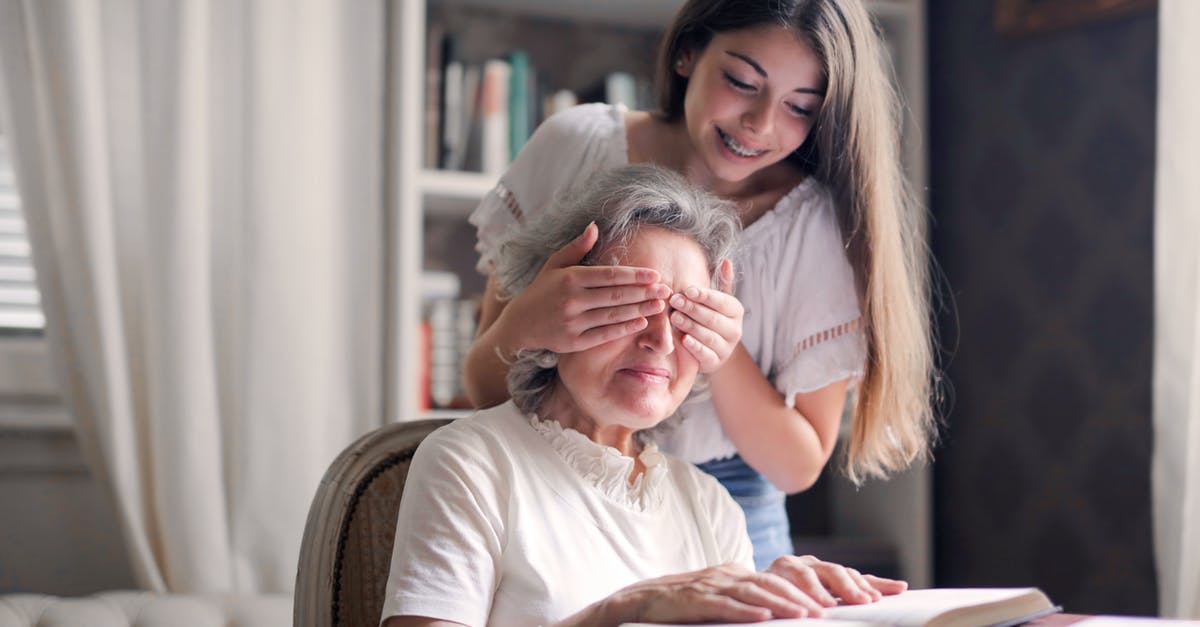 How can a video game with multiple endings have a sequel? [closed] - From below pensive gray haired woman trying to guess who closing eyes while sitting at table and reading book in light library in cottage