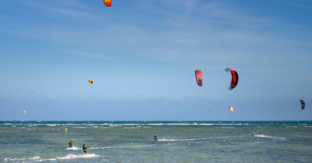 How can I attack move click to kite while only targeting champs? - Distant unrecognizable travelers riding waves on board while practicing kiteboarding during summer holiday on sunny day How can I attack move click to kite while only targeting champs? - Distant unrecognizable travelers riding waves on board while practicing kiteboarding during summer holiday on sunny day