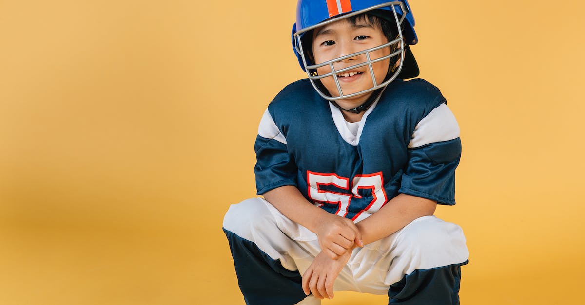 How can I automatically protect blocks placed by a player in Minecraft? - Positive Asian boy wearing protective helmet and sportswear of American football player in yellow studio How can I automatically protect blocks placed by a player in Minecraft? - Positive Asian boy wearing protective helmet and sportswear of American football player in yellow studio
