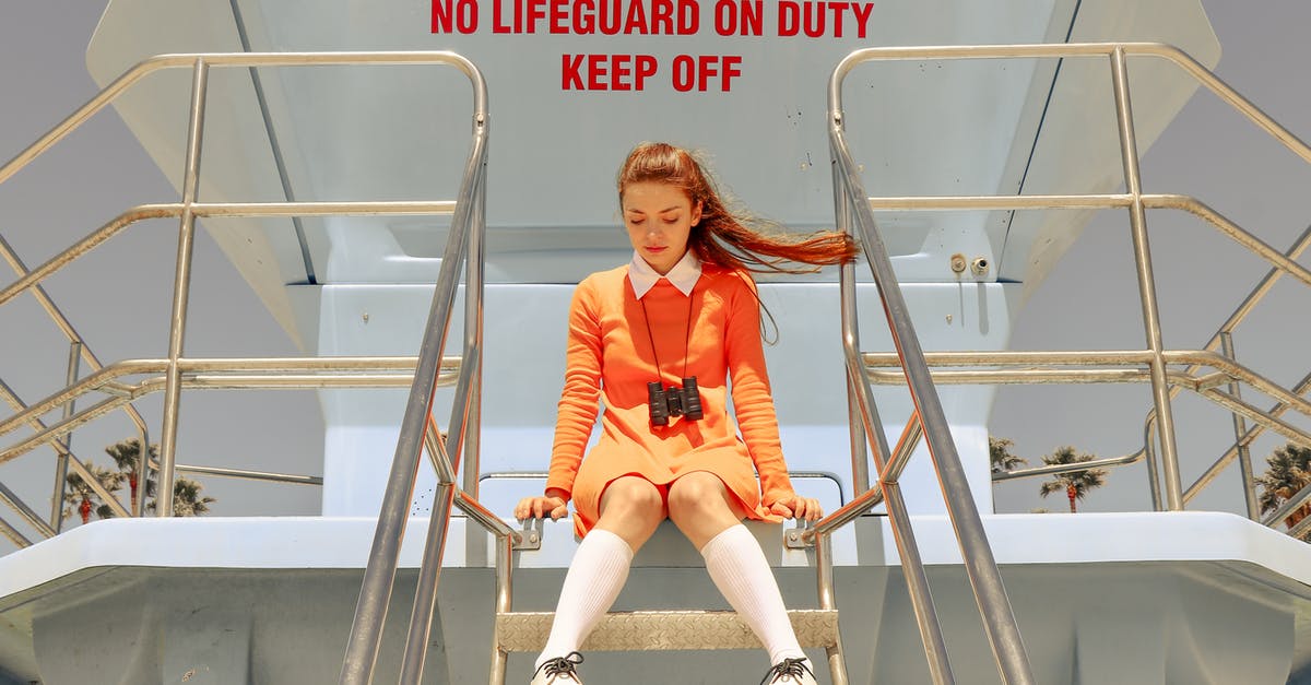 How can I build on top of lakes? - Woman in Orange Dress Sitting on Top of Diving Tower