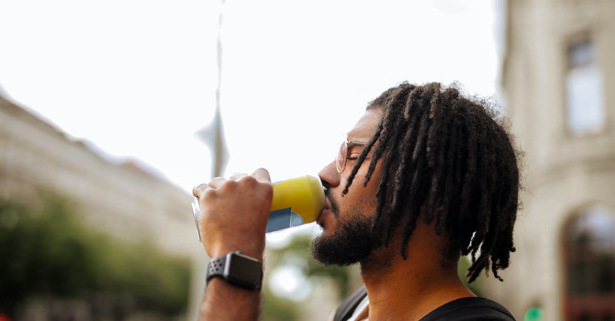 How can I change my character's appearance after starting Pokémon GO? - Side view of adult Hispanic guy with dreadlocks in sunglasses and casual clothes with backpack and smart watch drinking yummy beverage from vivid yellow can while standing with eyes closed on street in downtown How can I change my character's appearance after starting Pokémon GO? - Side view of adult Hispanic guy with dreadlocks in sunglasses and casual clothes with backpack and smart watch drinking yummy beverage from vivid yellow can while standing with eyes closed on street in downtown