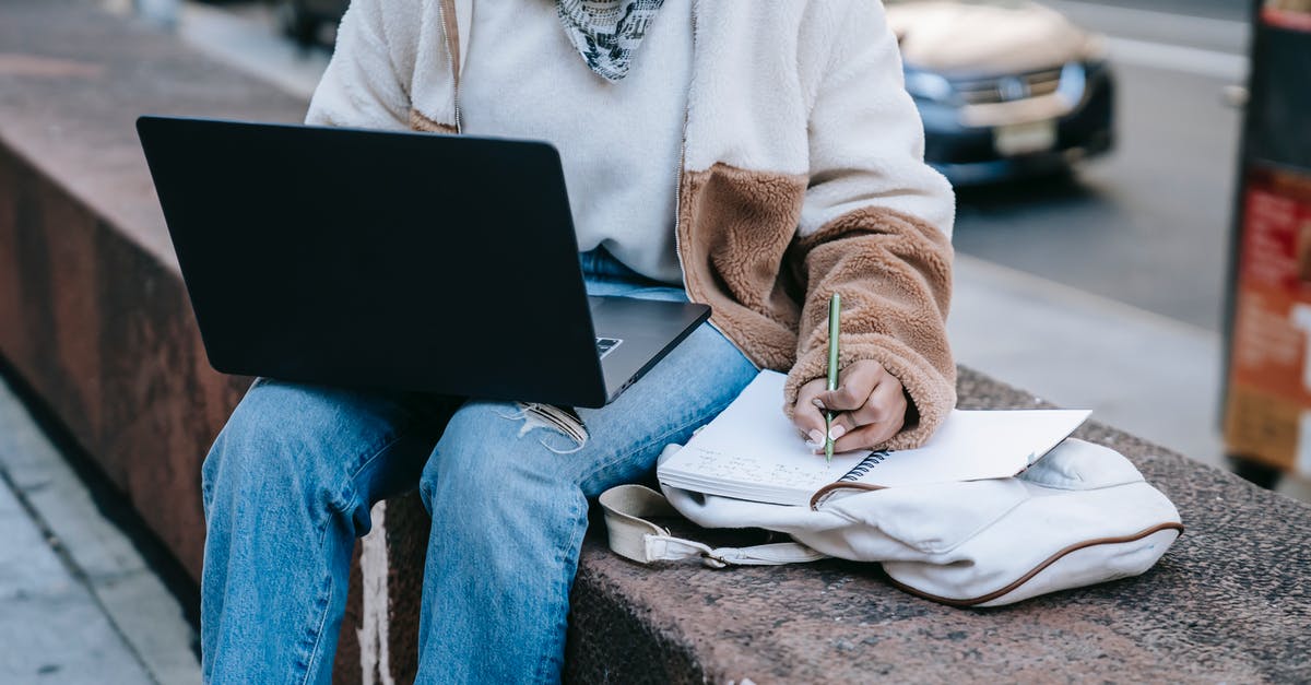 How can I check whether a city Network Node has already been linked to an Alien Artifact? - Anonymous female using laptop and taking notes on street