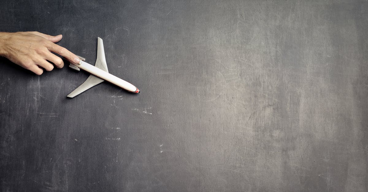 How can I copy a part of my minecraft world and put it into another world on Minecraft Pocket Edition? - Top view of crop anonymous person driving toy airplane on empty blackboard while representing journey concept