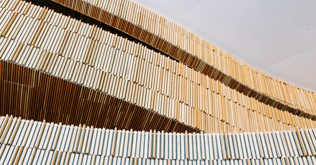 How can I detect if only one out of 8 lines of redstone is on and block the others from passing trough? - From below of geometric minimalist wooden construction under white ceiling in modern building